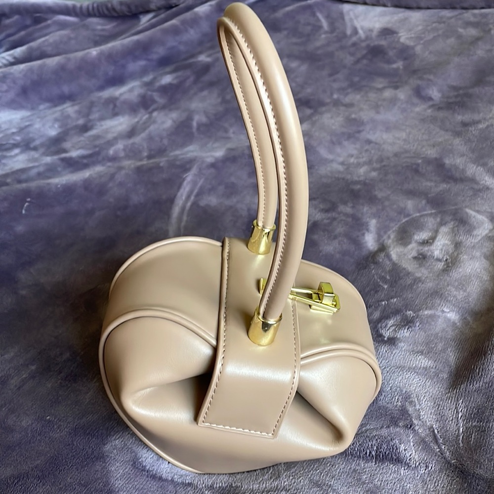 Beige small dumpling hobo bag I purchased brand new and never used.